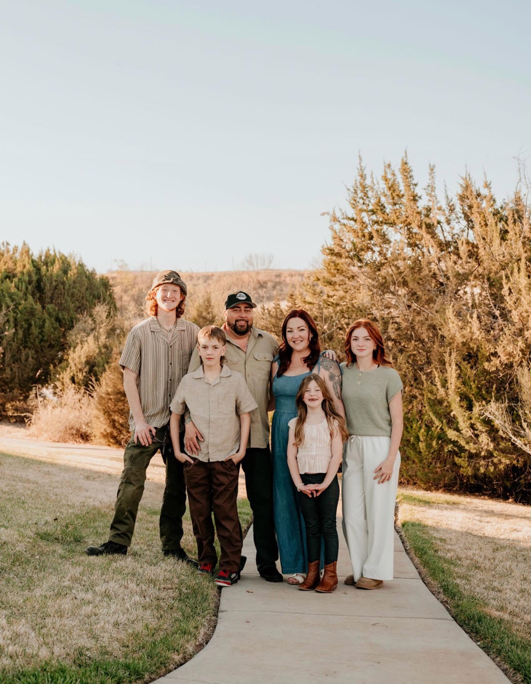 Abby and her family outdoors